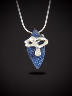 Front view of the Blue Flame necklace featuring a pointed, shield-shaped cobalt blue titanium druzy pendant wrapped in an abstract sterling silver custom casting on a silver snake chain against a dark gradient background.