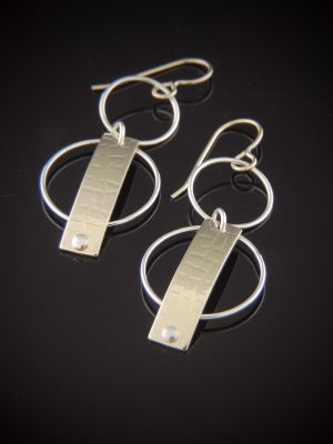 Sterling silver and gold-filled geometric drop earrings with circular elements and a textured rectangular bar on gold filled hooks