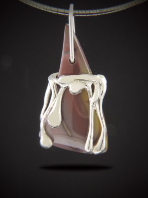 Hand-cast sterling silver "liquid" overlay on a triangular brown stone pendant, hanging from a silver Omega chain.