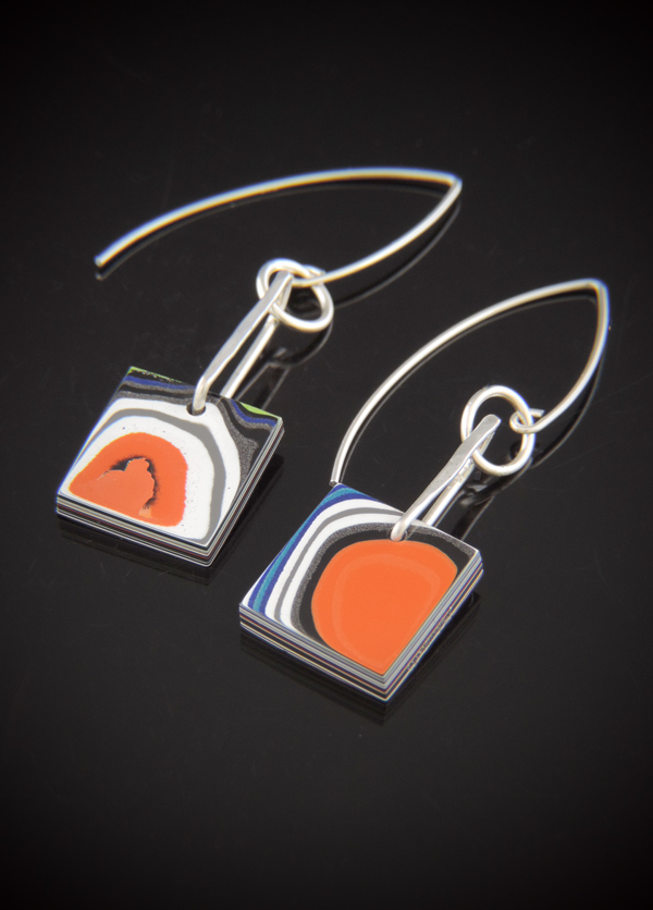 One-of-a-kind square Cable Car Fordite earrings featuring orange, black, and white swirls on sterling silver V-shaped ear wires