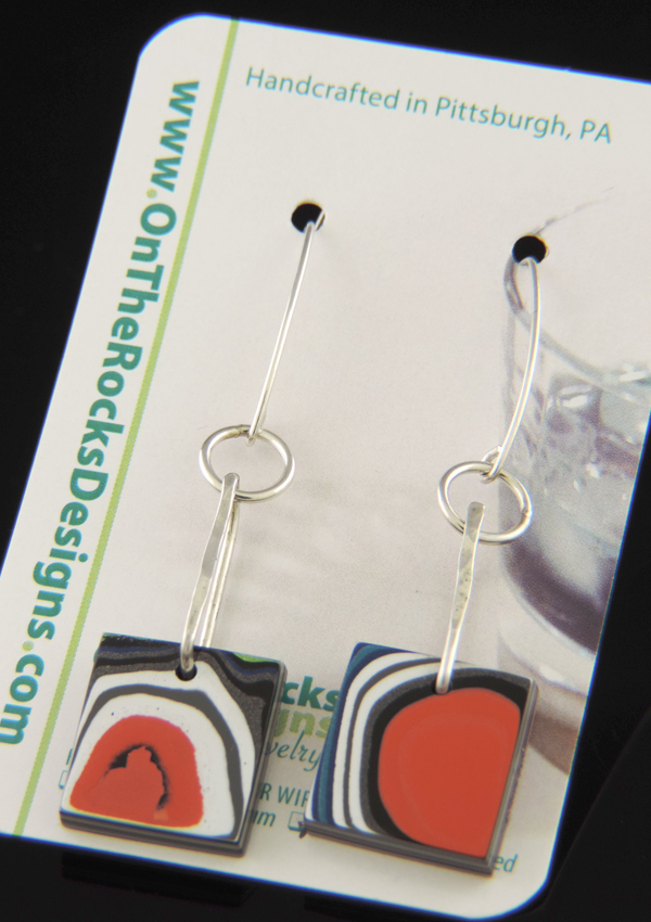 One-of-a-kind square Cable Car Fordite earrings featuring orange, black, and white swirls on sterling silver V-shaped ear wires