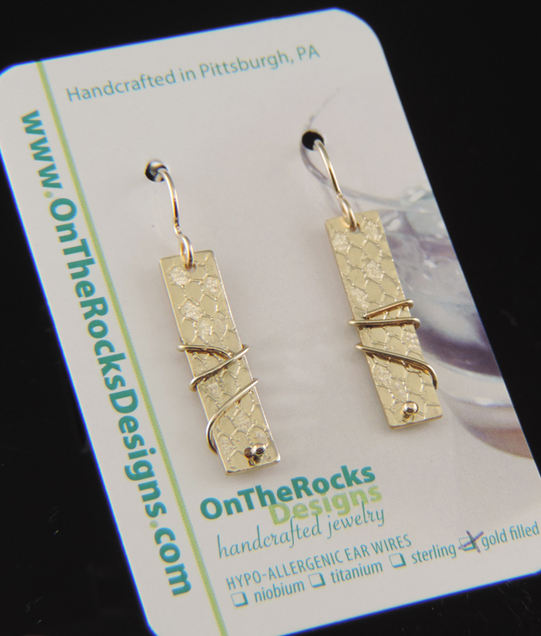 Pair of gold-filled rectangular tab earrings with a mesh-textured surface and decorative wire wrapping on gold-filled hooks.
