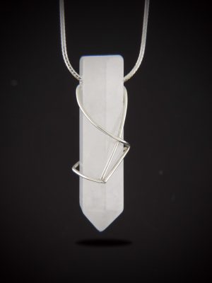 Minimalist white quartz crystal point pendant with a thin sterling silver wire wrap on a shimmering diamond-cut chain