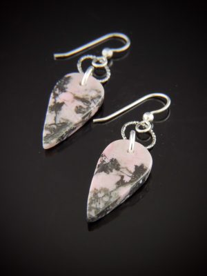 Leaf-shaped Rhodochrosite drop earrings with soft pink and dark dendritic patterning, suspended from Sterling Silver shepherd's hook wires with diamond-cut Rhodium and Sterling Silver links