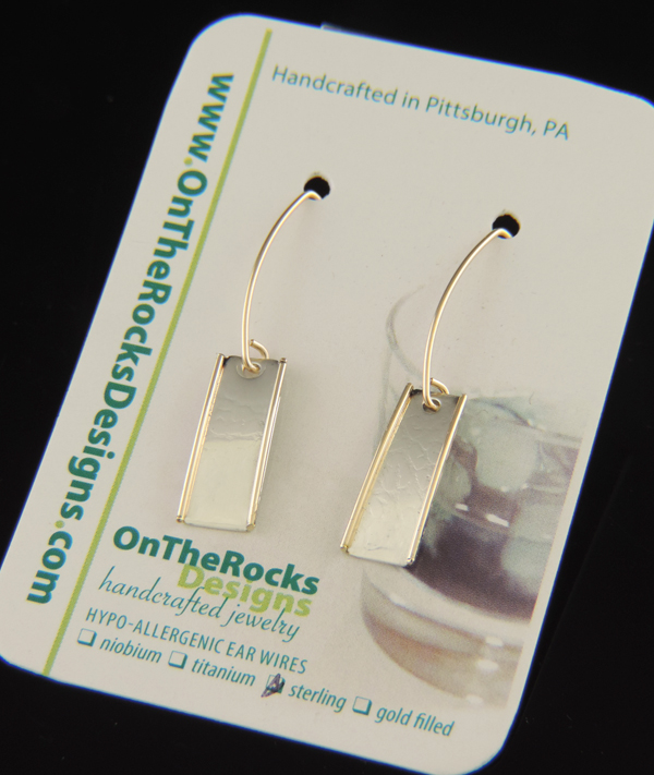 Limoncello Spritz drop earrings featuring textured sterling silver rectangular dangles with gold-filled wire side accents hanging on gold-filled ear wires.